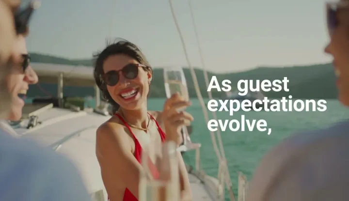 Sabre Hospitality SynXis Retailing - Sabre Hospitality - Image of woman on boat drinking champagne.